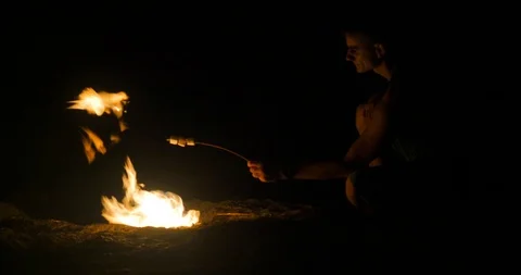 Man roast marshmallow on fire Stock Footage 94885108