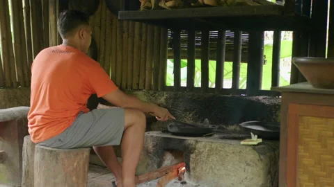 Man Roasting Coffee Over Traditional Stove, Bali Stock Footage 147259489