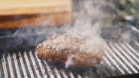 Man Roasting Fillet Steak With Fork In Kitchen Stock Footage 86071274