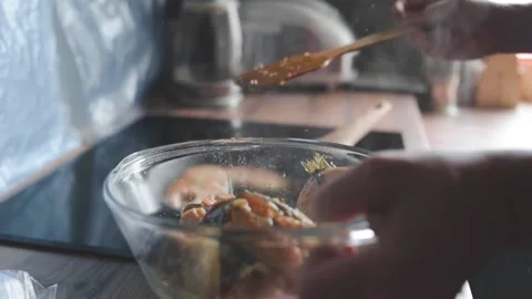 A man roasts fish Stock Footage 131495051