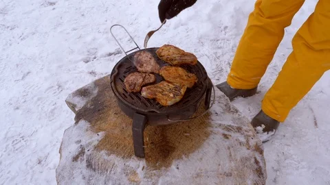 Man roasts steaks on grill Stock Footage 105563838