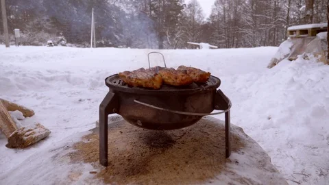 Man roasts steaks on grill Stock Footage 105567405