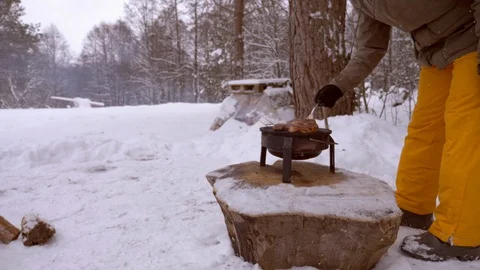 Man roasts steaks on grill Stock Footage 122313640