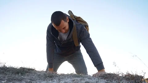 Man rock climber struggles to the top of the mountain with difficulty striving 스톡 동영상 97147751
