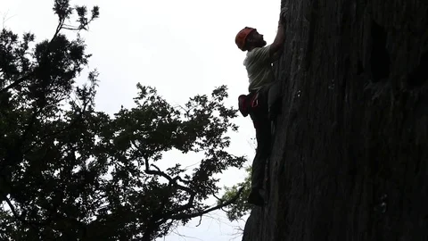 Man rock climbing. Looking downwards. Slow motion 120 fps. Видео 72861071