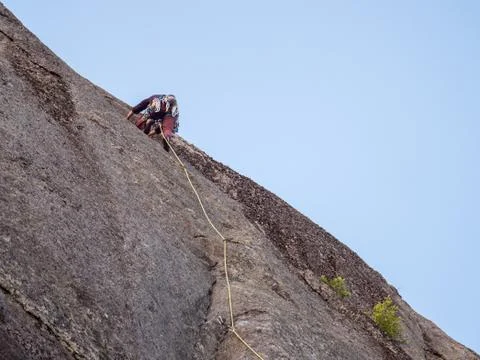 Man rock climbing wall Stock Photos