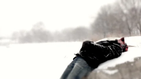 Man on a Rock During Blizzard Stock Footage 162257335