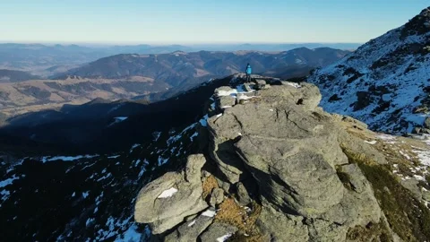 A Man on a Rock, looking at the panorama, a view from a drone Stock Footage 175488890