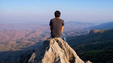 Man on rock at mountain Stock Photos