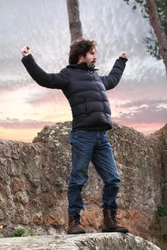 Man on a rock Stock Photos