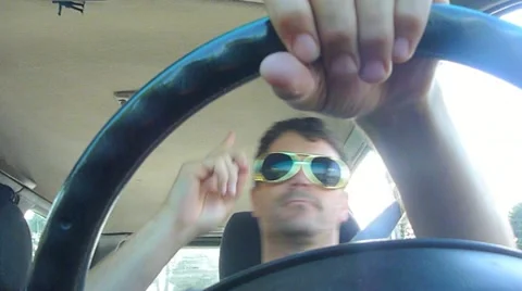 Man Rocking Out While Driving Car Stock Footage 21426731