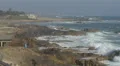 Man on rocks near the ocean, Porto 4k or 4k+ Resolution