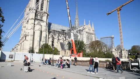Man on roller blades performing near Notre Dame Stock Footage 289535992