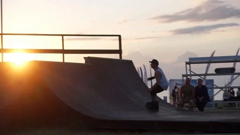 Man in roller skates jumping on the springboard Video stock 102781240