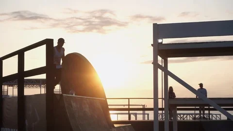 Man on roller skates pulls down from the springboard Stock-Footage 102781203