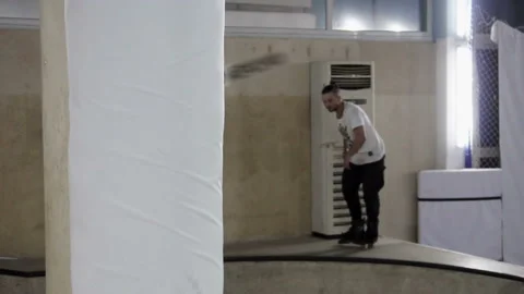 Man on roller skates slides down the slope Stock-Footage 102131789