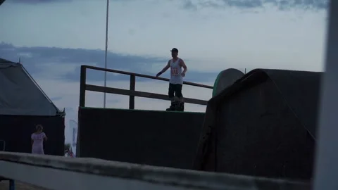Man on roller skates stands and warm up 스톡 동영상 102786502