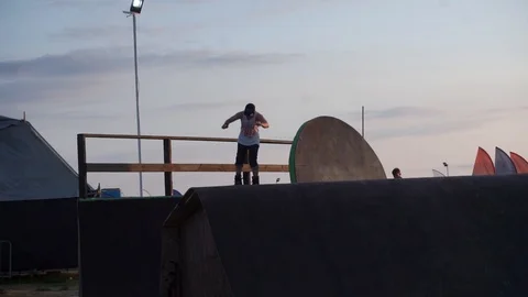 Man roller skating performs tricks in skate park Stock-Footage 102780857