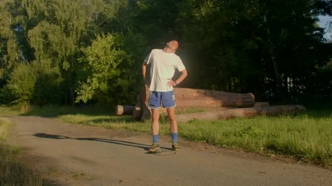 A man rollerblades through scenic paths, showcasing freedom and joy Stock Footage 314346645