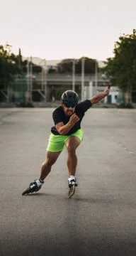 Man rollerblading on asphalt enjoying inline skating Stock Photos