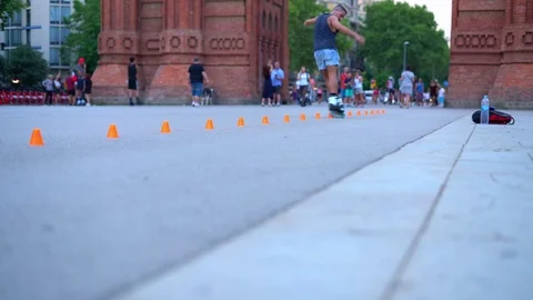 Man rollerblading between cones on the street Stock Footage 113118173