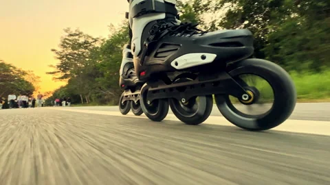 Man rollerblading close up. Roller skating legs closeup Skater boy rollerskating Stock Footage 300244537