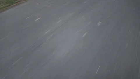 Man rollerblading fast on a smooth path in a park during daytime Video stock 338307014