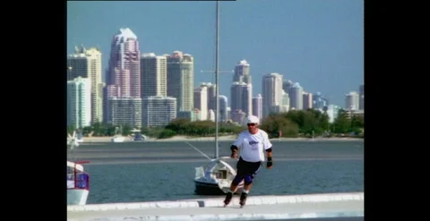 Man Rollerblading (Slow Motion) by Waterfront, Queensland, Australia  (1990s) Stock Footage 310928717