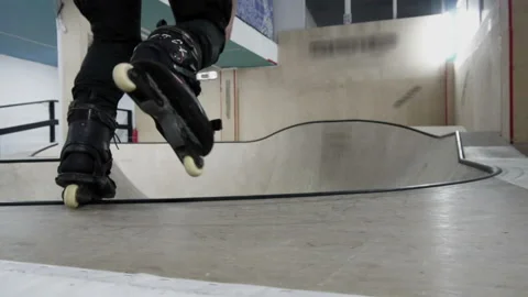 Man on the rollers performs tricks on the training ground Stock Footage 102150034