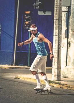 A man rollerskating in a street. Foto stock