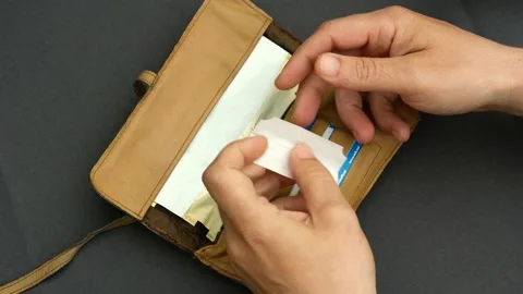 Man Rolling A Cigarette, Close Up, In a Homemade Tobacco Bag. Stock Footage 130509439