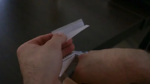 Man rolling up a cigarette Stock Footage 93198928