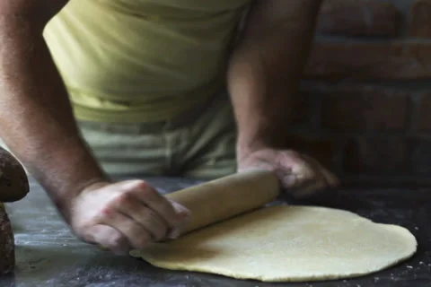 Man rolling the dough, slow motion at 60 fps Stock Footage 31702053