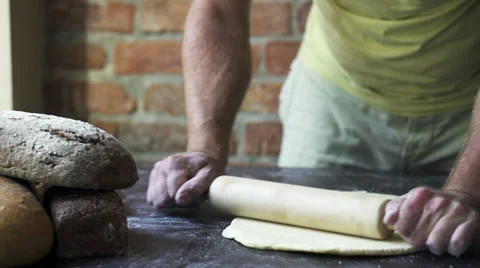 Man rolling the dough, slow motion at 240 fps Stock Footage 31713108