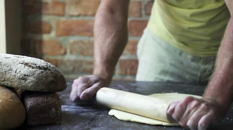Man rolling the dough, slow motion at 60 fps Stock Footage 31713323
