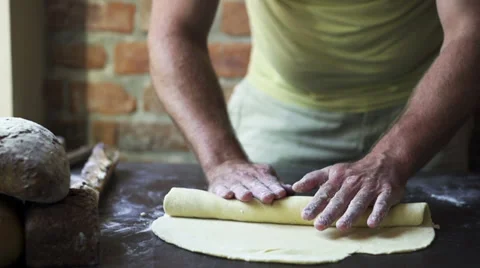 Man rolling dough, slow motion at 240 fps Stock Footage 31713605