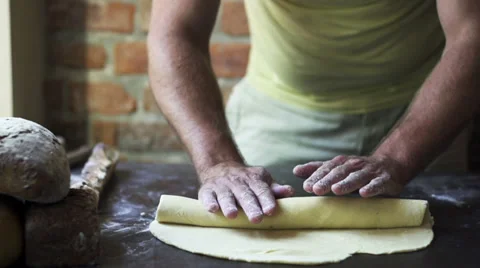 Man rolling dough, slow motion at 60 fps Stock Footage 31713793