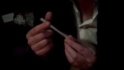 Man rolling joint. Stock Footage 79661466