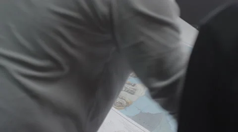Man rolling a map in the office Stock Footage 67554116