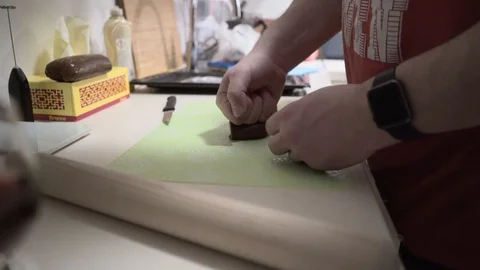Man rolling pin for gingerbread. Hands work with the test. Christmas sweets Stock Footage 128623841