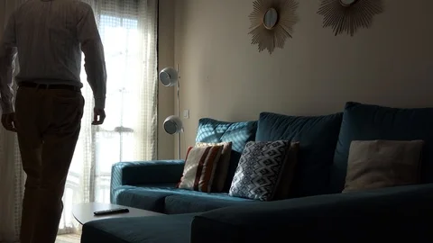 Man rolling pulling down closing Window Shutters  Stock Footage 102620430