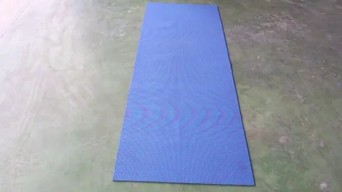 Man rolls the carpet Stock Footage 72976561