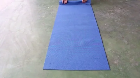 Man rolls the carpet Stock Footage 72976586