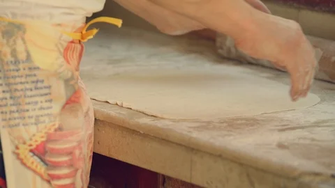 Man rolls dough with rolling pin for pita breads  in local Bulgarian restaurant Vídeo Stock 113951016