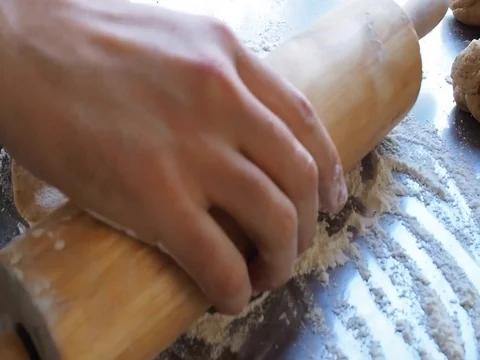 Man rolls out the dough Stock Footage 81974800
