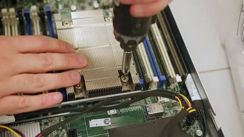 A man in a room for assembling server and computer equipment, adds parts, compon Stock-Footage 208296929
