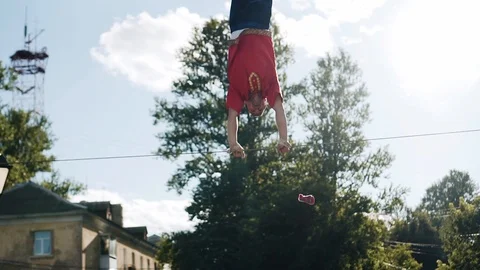 The man rotates around the rope holding his hands behind him Stock Footage 111539944