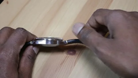 Man rotates watch bezel Stock Footage 133179444