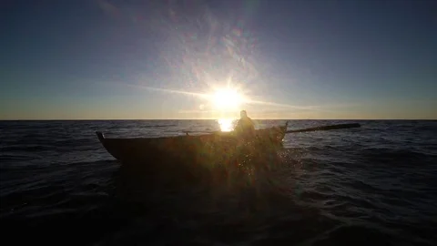Man in row boat. silhouette. Stock Footage 77975015
