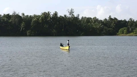 Man rowing boat alone Stock Footage 83177975